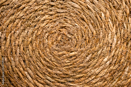 Close Up of a Round Esparto Grass Mat, Natural Fiber Background.