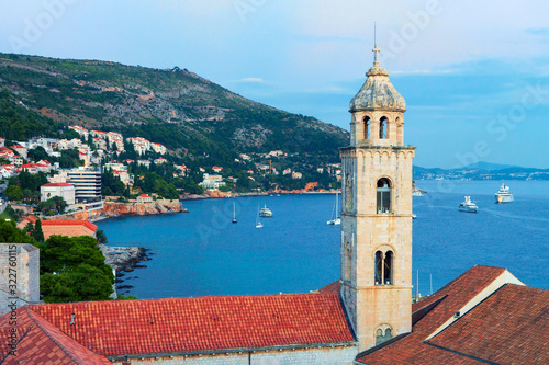 Old church belfry and Adriatic Sea in Dubrovnik evening