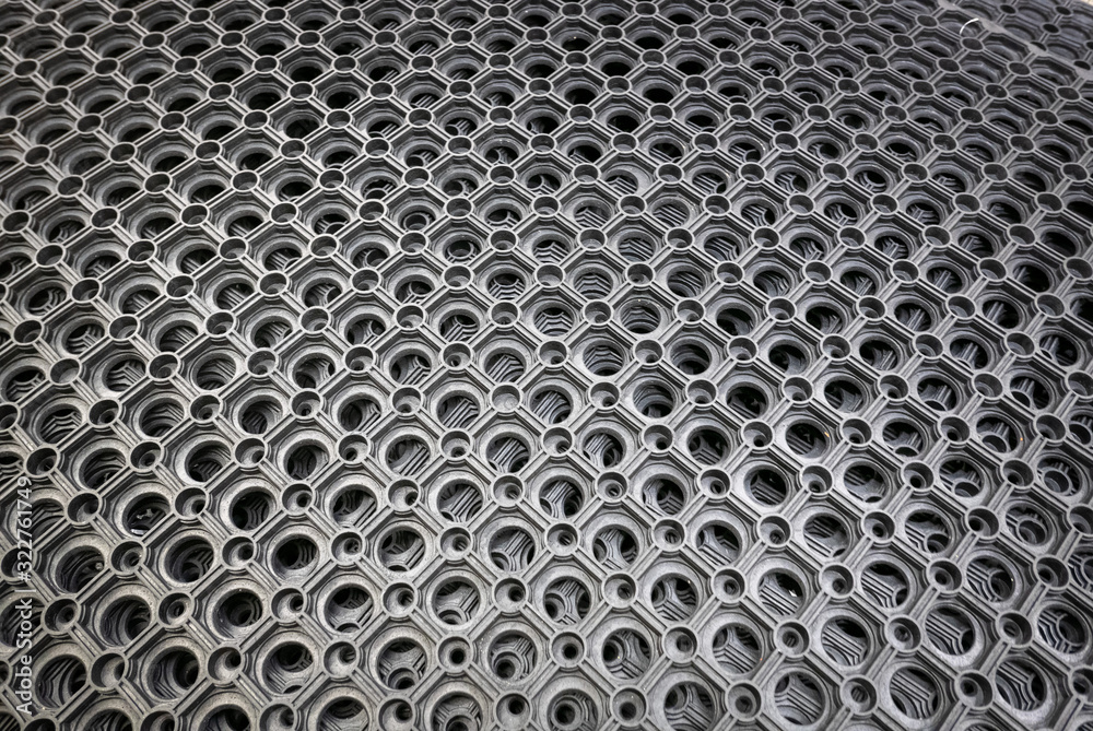 Perforated metal pattern background. Black and gray metal background. Perforated metal pattern background. Black and gray metal background.