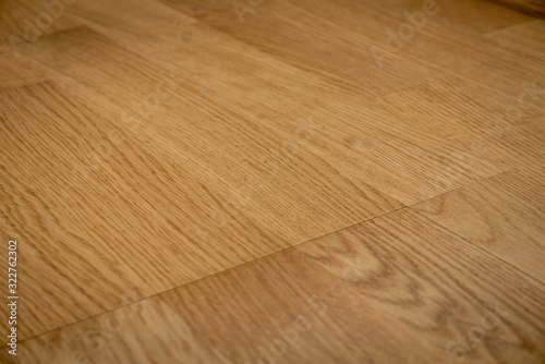Dark brown wooden parquet floor texture background