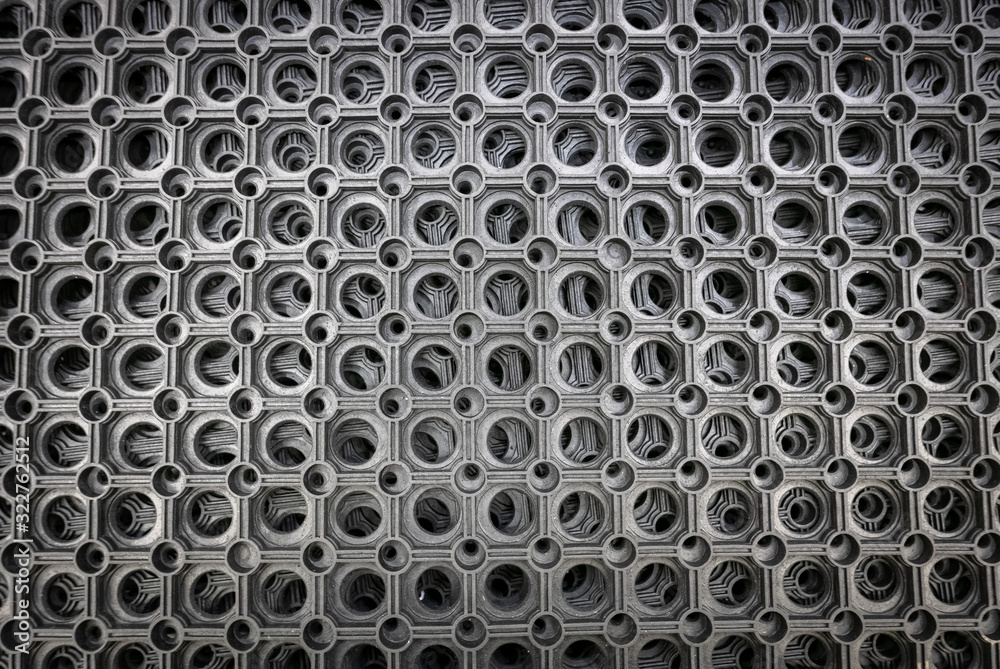 Perforated metal pattern background. Black and gray metal background. Perforated metal pattern background. Black and gray metal background.
