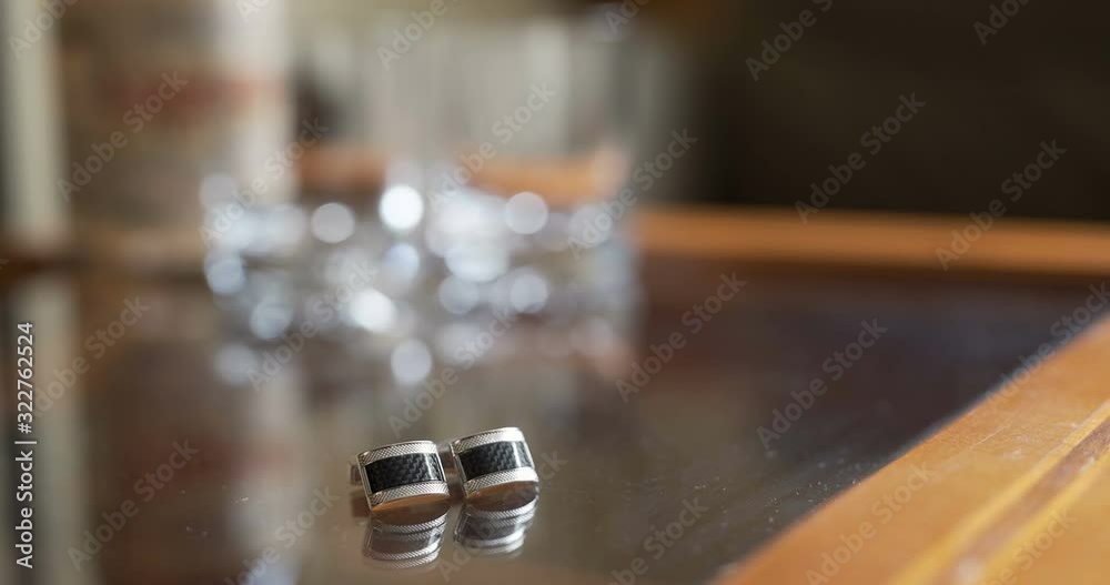 Wedding Preparations - Groom's Cufflinks on table Wedding Preparations - Groom's Cufflinks on table