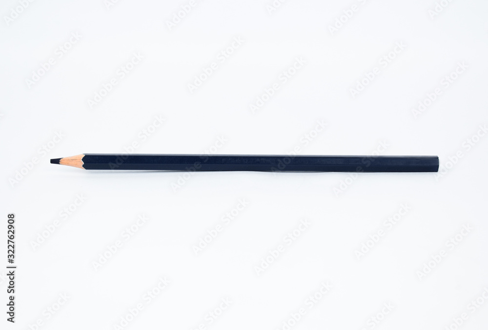A navy blue colored sharp wood pencil crayon isolated on a white background A navy blue colored sharp wood pencil crayon isolated on a white background