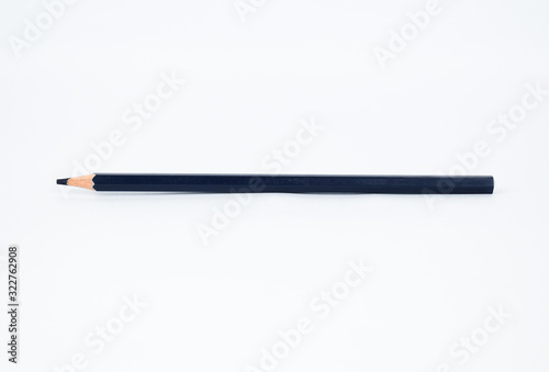 A navy blue colored sharp wood pencil crayon isolated on a white background
