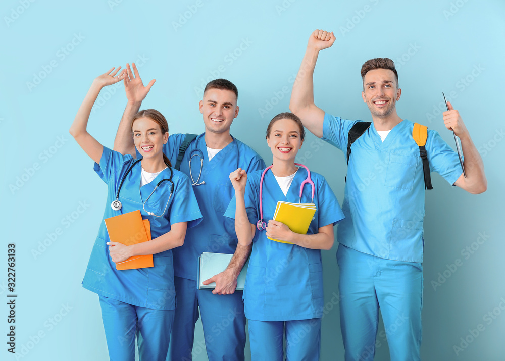 Group of happy medical students on color background Group of happy medical students on color background