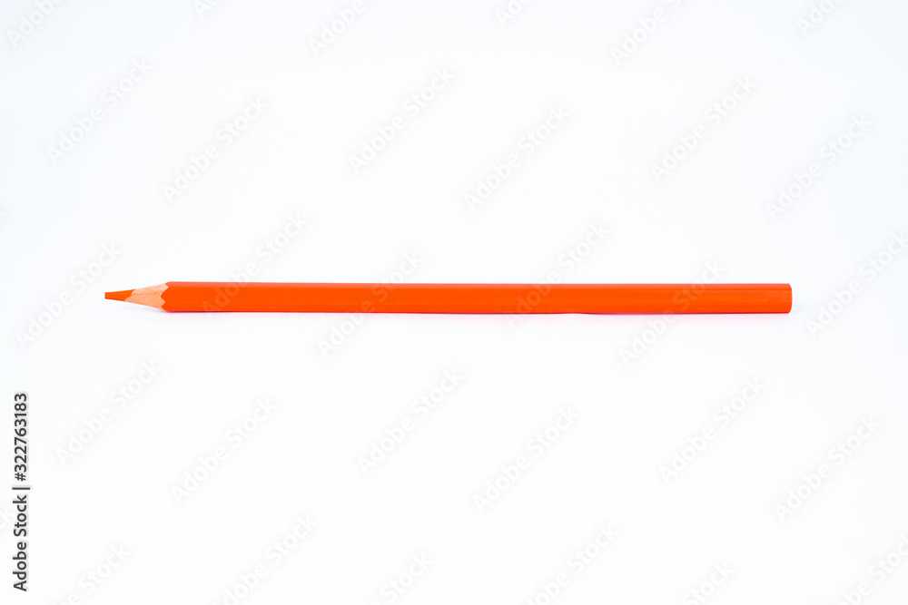 Orange wood pencil crayon with a sharp tip isolated on a white background Orange wood pencil crayon with a sharp tip isolated on a white background