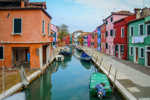 Fototapeta Naklejka Na Ścianę i Meble -  Colors and boats in the streets of Burano, Venice, Italy, Europe.