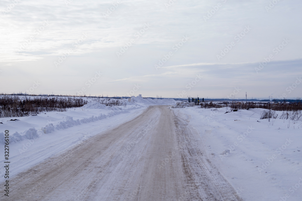 long winter road in the field