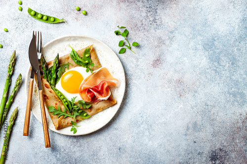 Quadro su tela Buckwheat crepes, galette bretonne with asparagus, egg, green pea, jambon or prosciutto