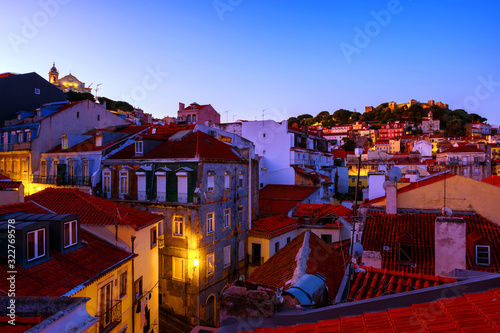 Aerial view of Lisbon, Portugal at sunrise with view over old Alfama and castle