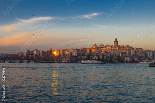 Bosphorus in winter on sunset with seagulls over the water