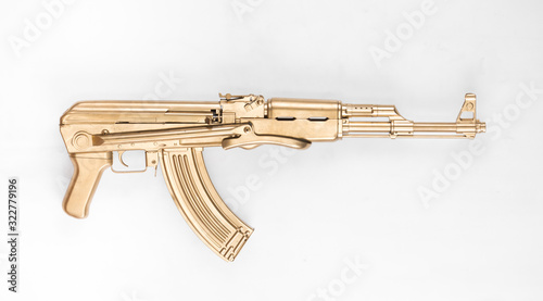 фотографія Golden Kalashnikov AK-47 assault rifle isolated on white background