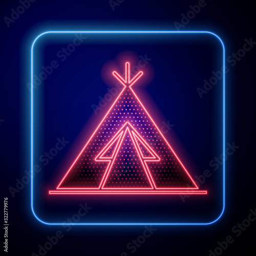 Glowing neon Traditional indian teepee or wigwam icon isolated on blue background. Indian tent.  Vector Illustration