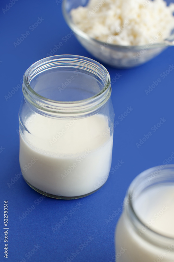 Fermented drink kefir in small bottles and kefir grains Fermented drink kefir in small bottles and kefir grains