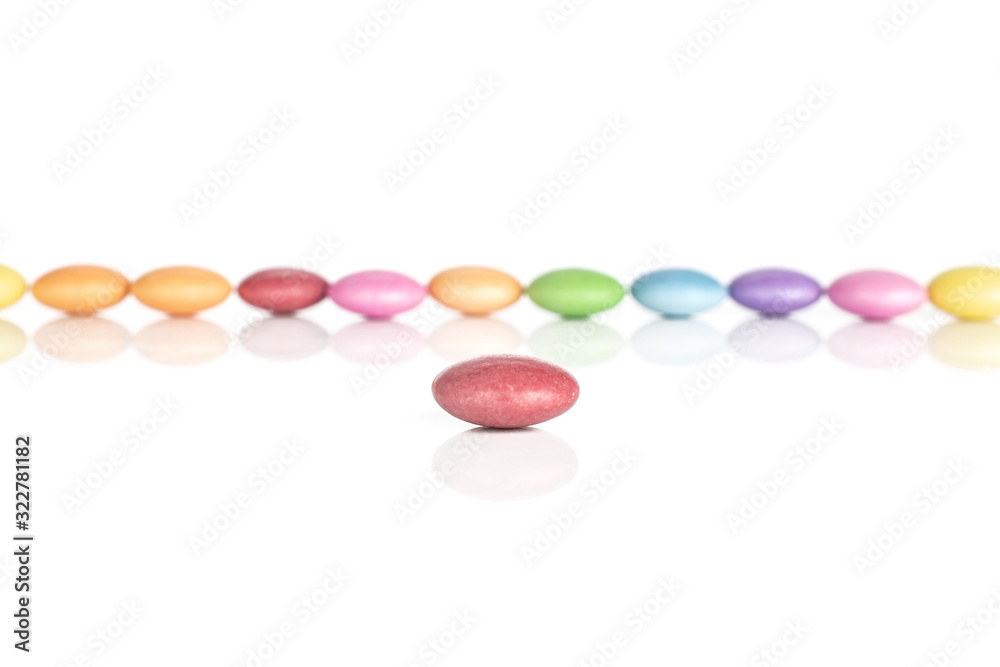 Lot of whole sweet colourful candy red in focus isolated on white background Lot of whole sweet colourful candy red in focus isolated on white background