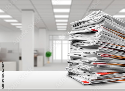 Stack file folders with documents on the desk photo