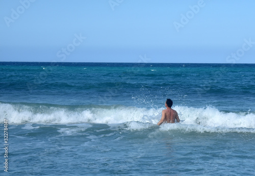 the guy is swimming in the Atlantic ocean. Dominican Republic © Igor