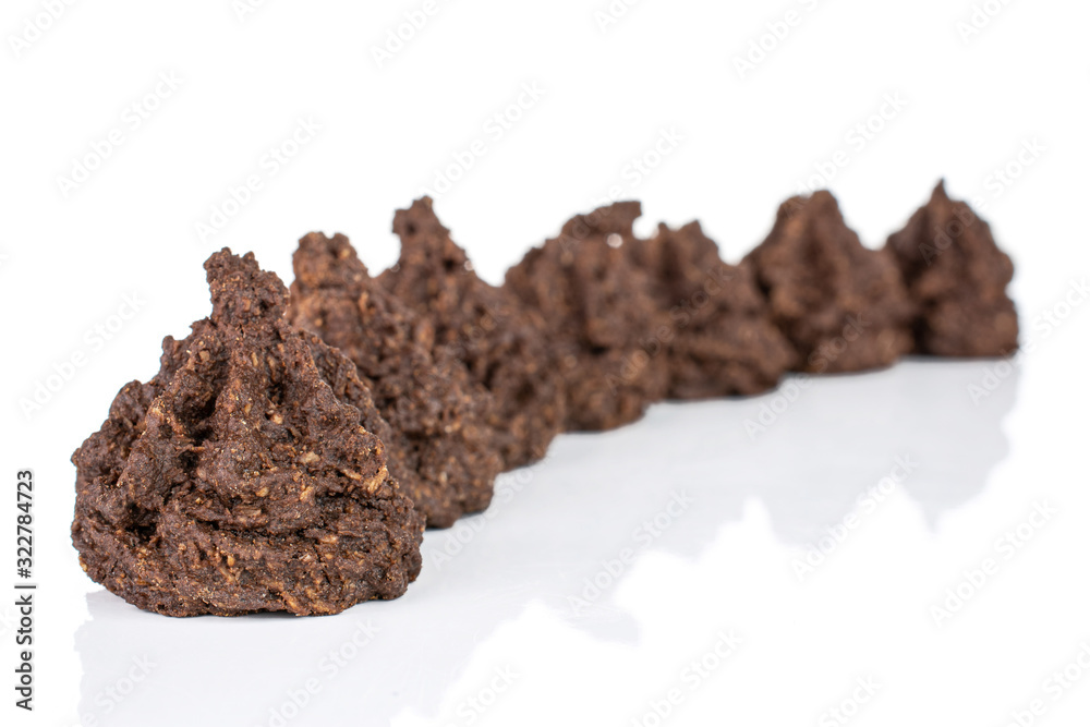 Lot of whole homemade brown coconut cocoa biscuit isolated on white background