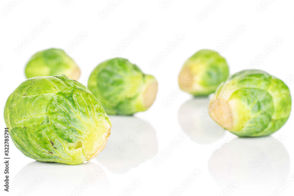 Group of five whole fresh green brussels sprout isolated on white background Group of five whole fresh green brussels sprout isolated on white background