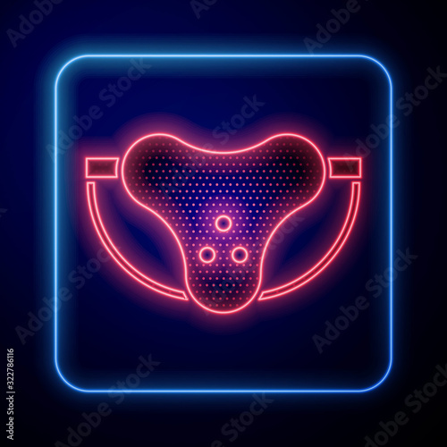 Glowing neon Protective sport jockstrap icon isolated on blue background.  Vector Illustration