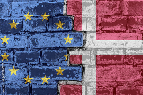 The flag of the European Union and Denmark on a brick wall