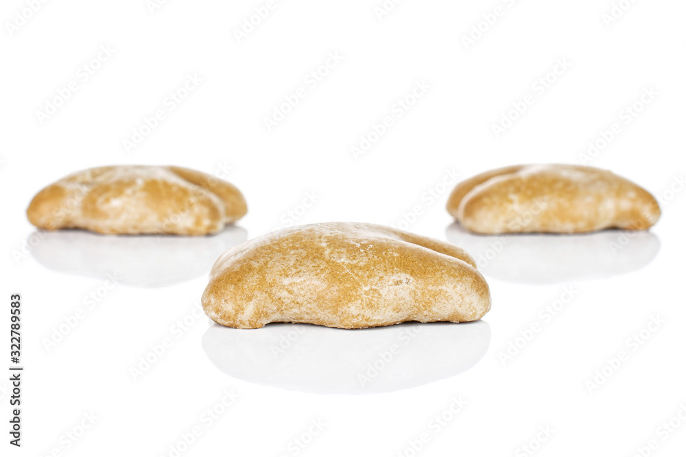 Group of three whole sweet brown gingerbread isolated on white background