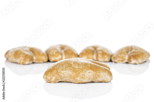 Group of five whole sweet brown gingerbread isolated on white background © PIXbank