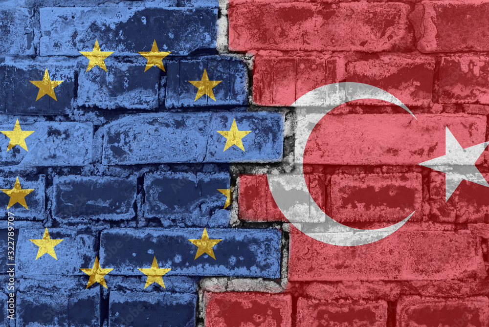 Fototapeta premium European Union and Turkey flag on a brick wall