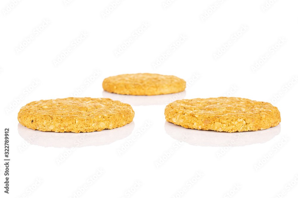 Group of three whole sweet golden oat cookie isolated on white background Group of three whole sweet golden oat cookie isolated on white background