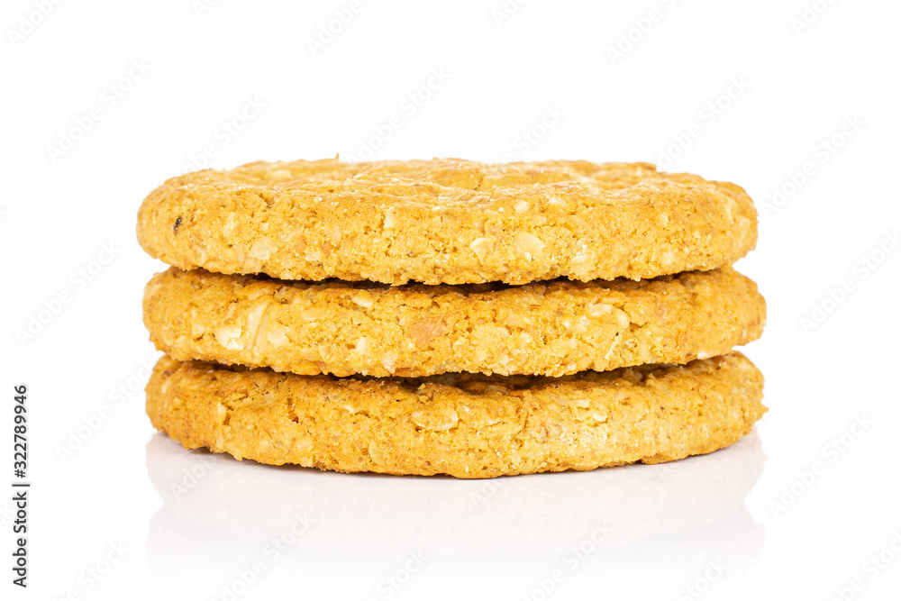 Group of three whole sweet golden oat cookie in column isolated on white background Group of three whole sweet golden oat cookie in column isolated on white background