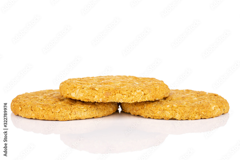 Group of three whole sweet golden oat cookie isolated on white background Group of three whole sweet golden oat cookie isolated on white background