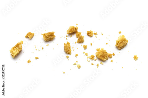 Scattered crumbs of butter cookies on white background. photo