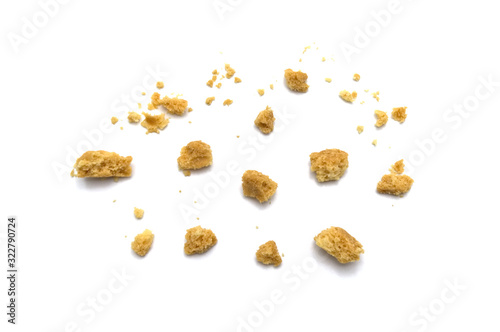 Scattered crumbs of butter cookies on white background. photo
