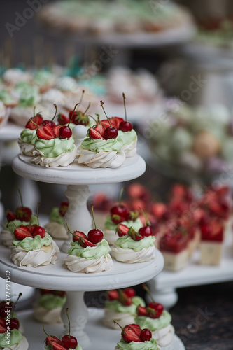 the wedding table is decorated with many beautiful desserts