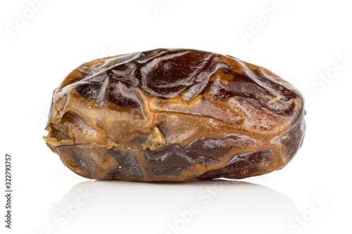 One whole dry brown date fruit isolated on white background