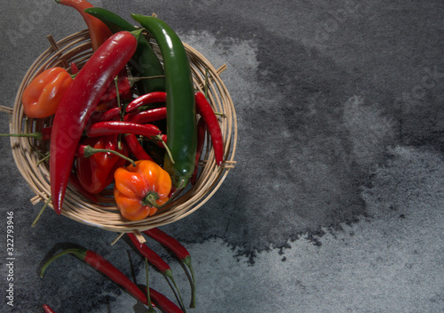 Chili pepper, different types and colors, with copy-space, on gray background