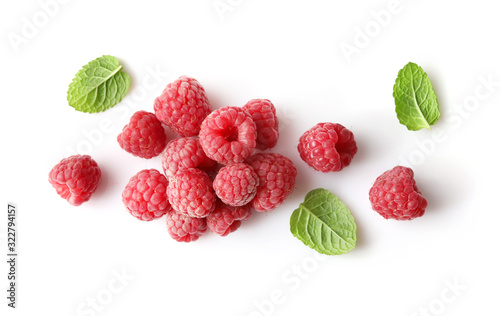 Fotografie, Obraz Ripe rasberries and mint isolated on white background. Top view