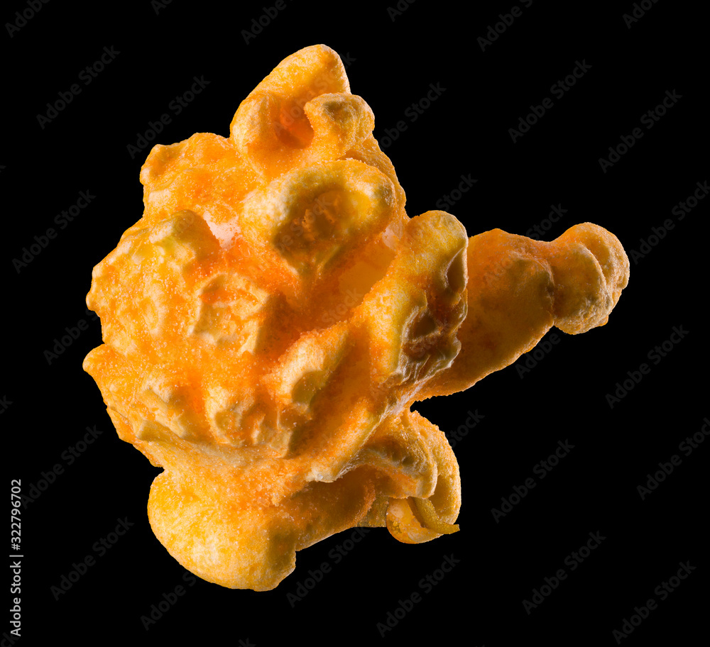 Single popped popcorn on a black background with clipping path Single popped popcorn on a black background with clipping path