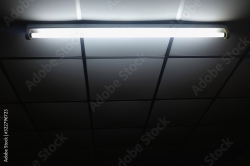 White old fluorescent lamp on ceiling