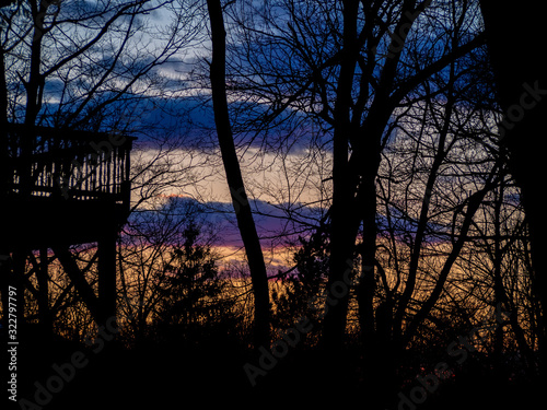 colorful winter sunset in the woods