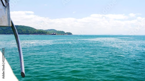 View from boat ariving at Ilha dos Frades pier, Bahia, Brazil photo