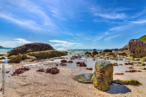 Scenic view of rocks and beach at the coastline of Lizard Island in Australia. photo