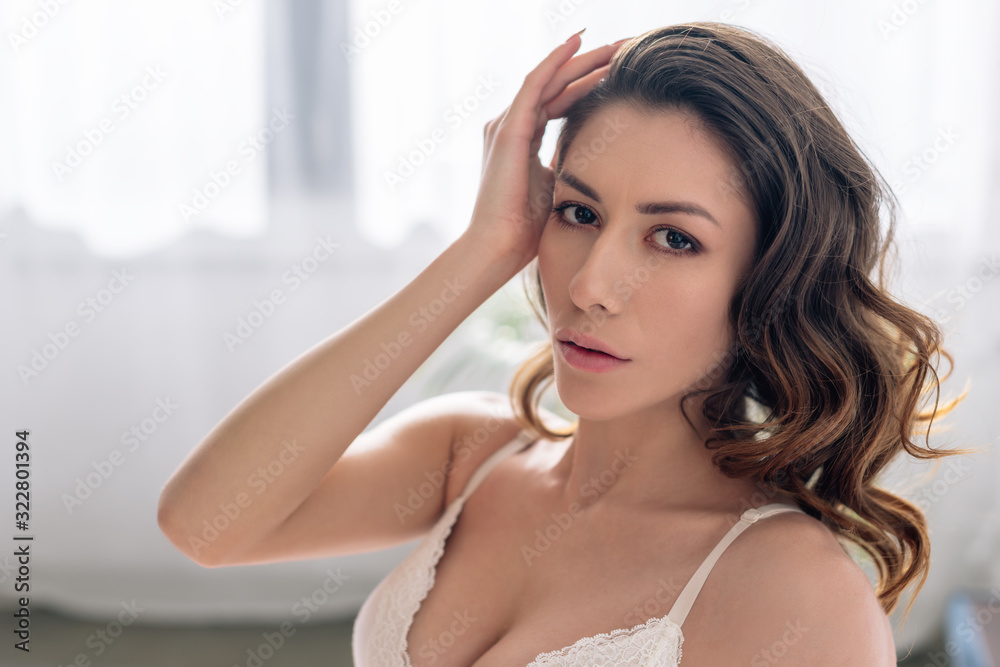 attractive and sexy woman in lace bra looking at camera attractive and sexy woman in lace bra looking at camera