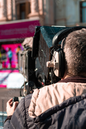 detail of a camera filming a bicycle race
