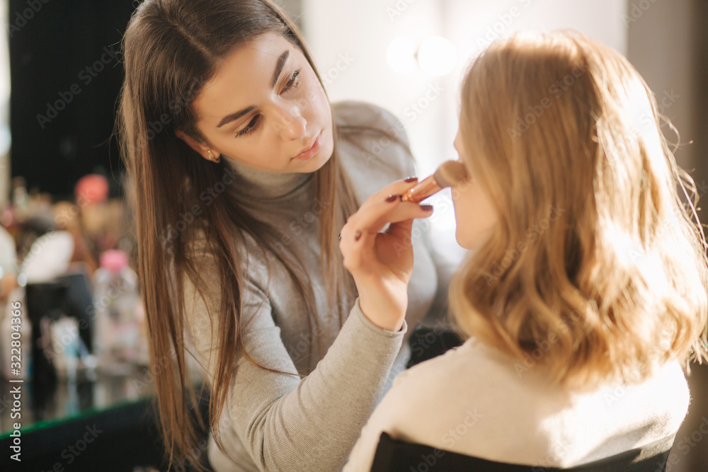 Makeup artist work with model in beauty studio. Start working. Model without makeup. Beautiful makeup artst Makeup artist work with model in beauty studio. Start working. Model without makeup. Beautiful makeup artst