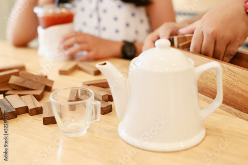 White teapot and clear glass tea