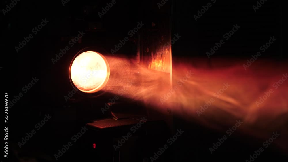Projector beam in a smokey dark room. Close-up shot with volumetric light.