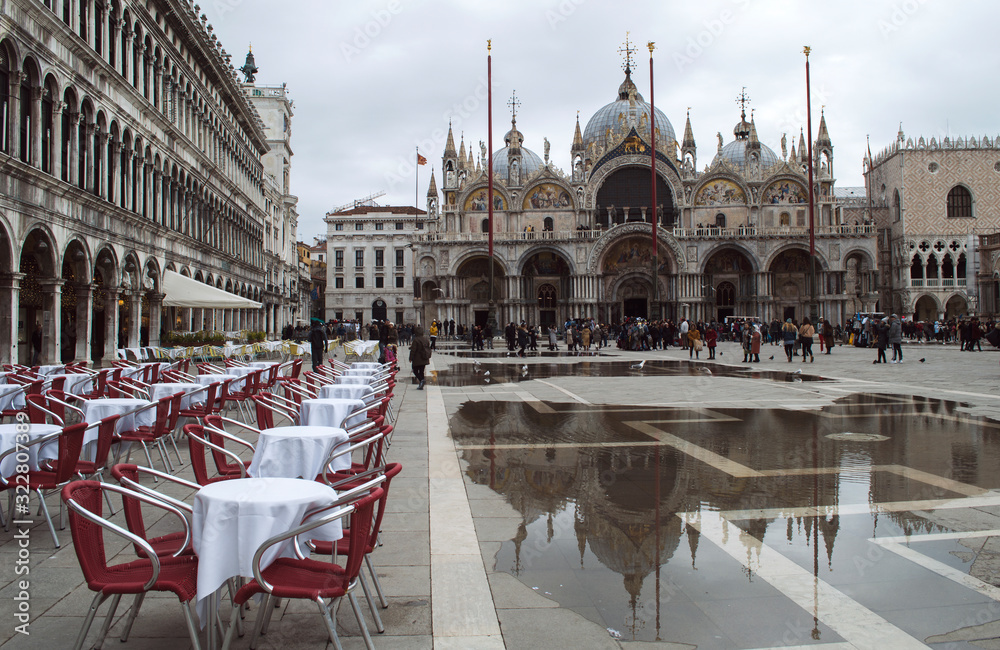 Obraz premium The famous Piazza San Marco in Venice with a reflection of the cathedral in the puddles.