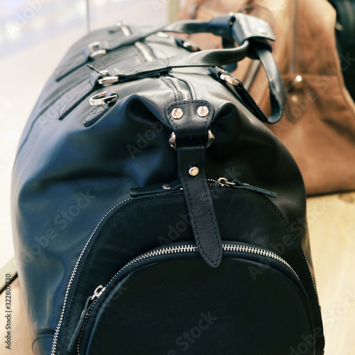 Road leather bag. Luxury travel. Casual style, beauty accessories. Beauty model. Retro style.