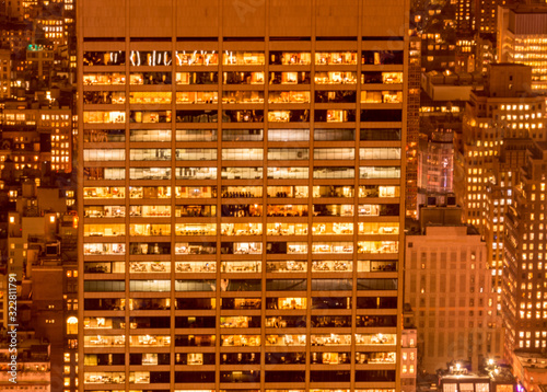 Office windows illuminated at night